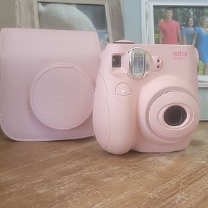Barely used pink instax mini 75...camera used 3 times. Comes with case.